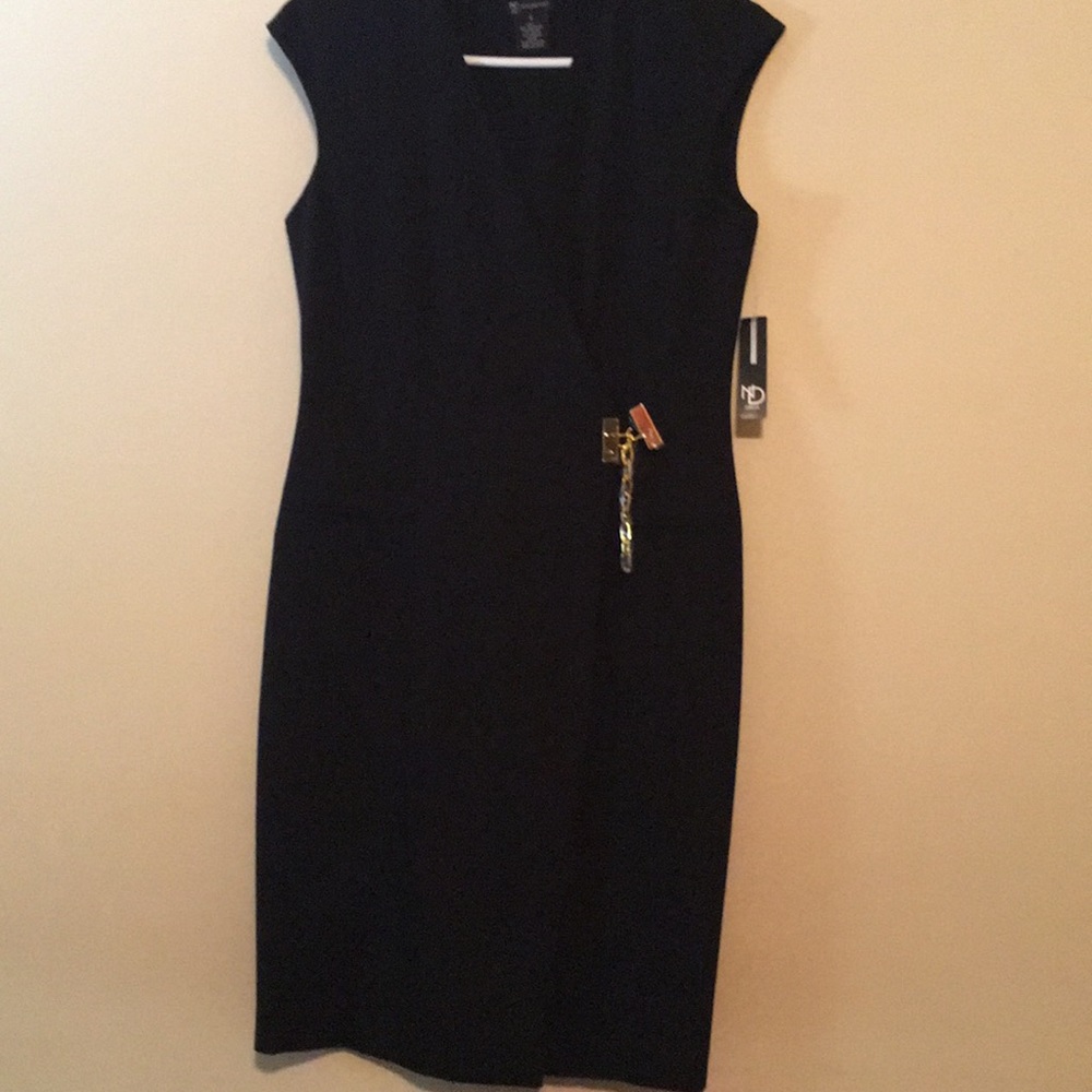 NEVER WORN. Black dress with gold hardware.